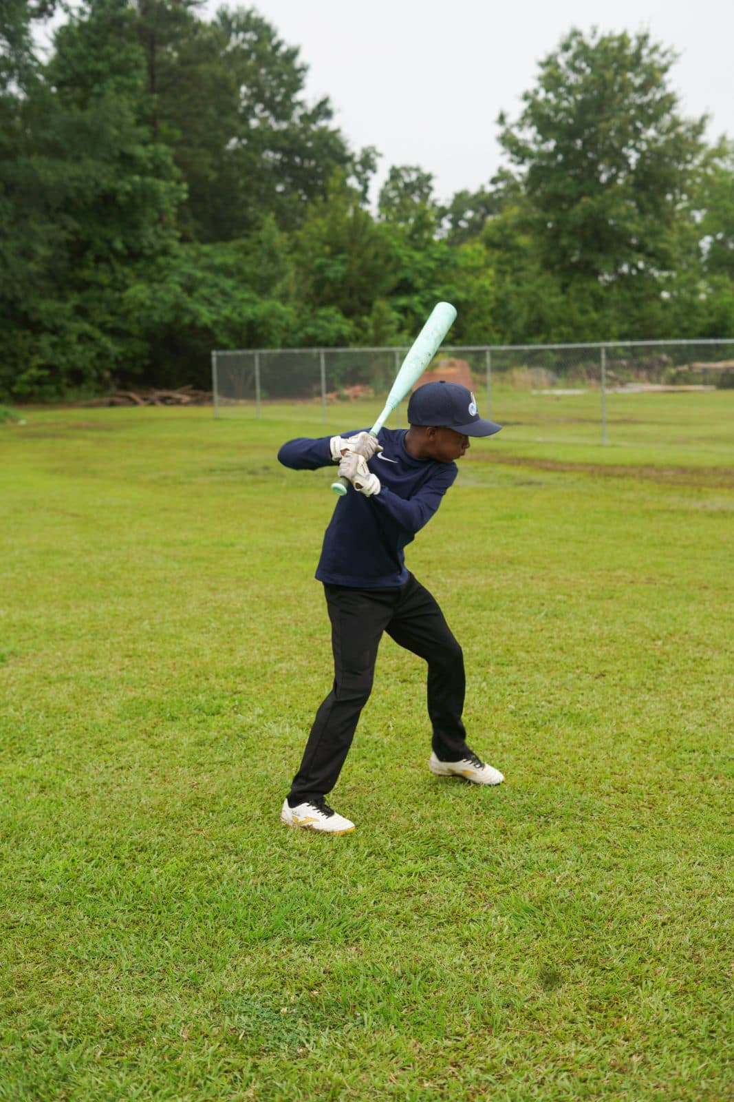 A young player set in his batting stance during MLB Pitch, Hit & Run.
