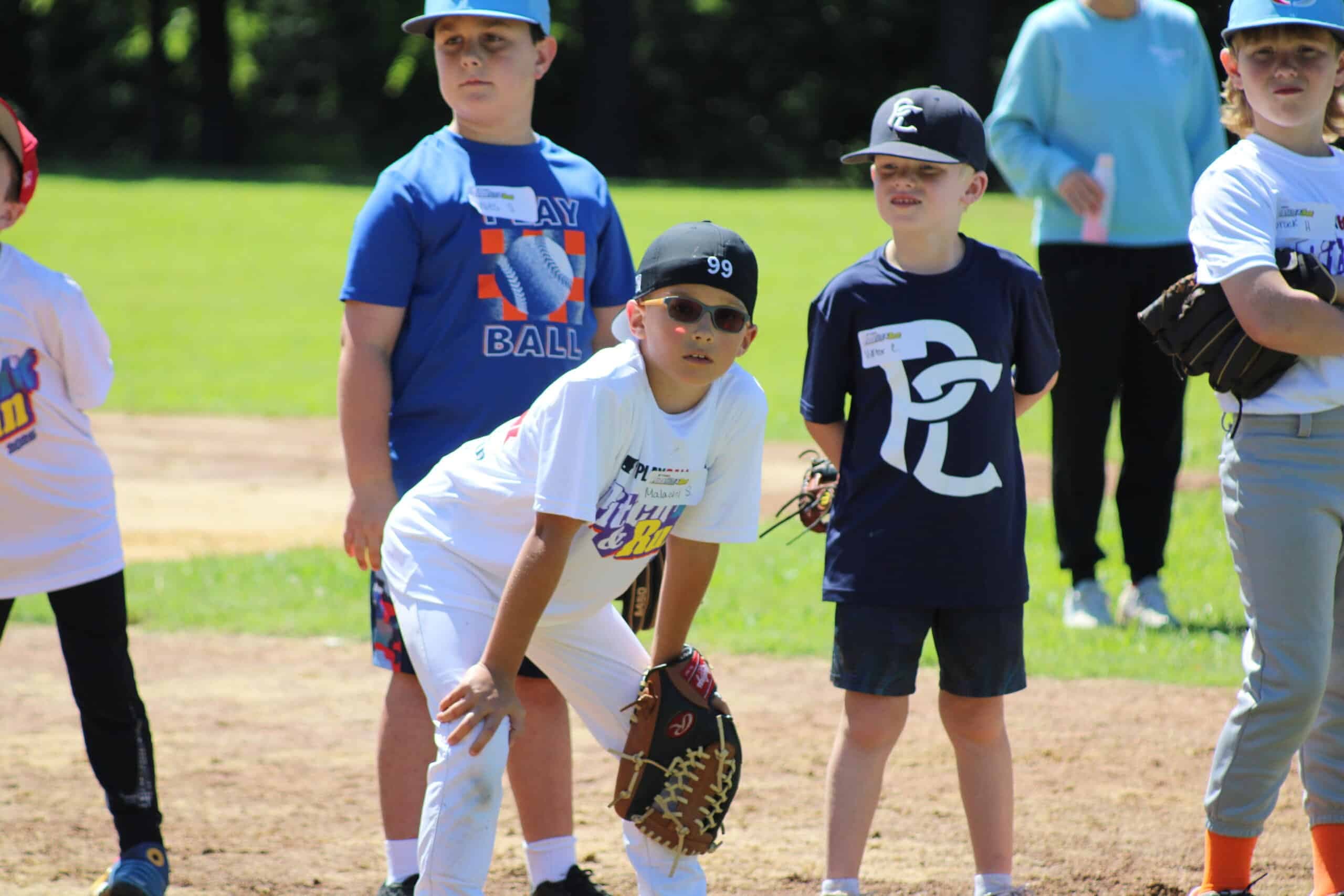 A young player set in fielding position during the competition.